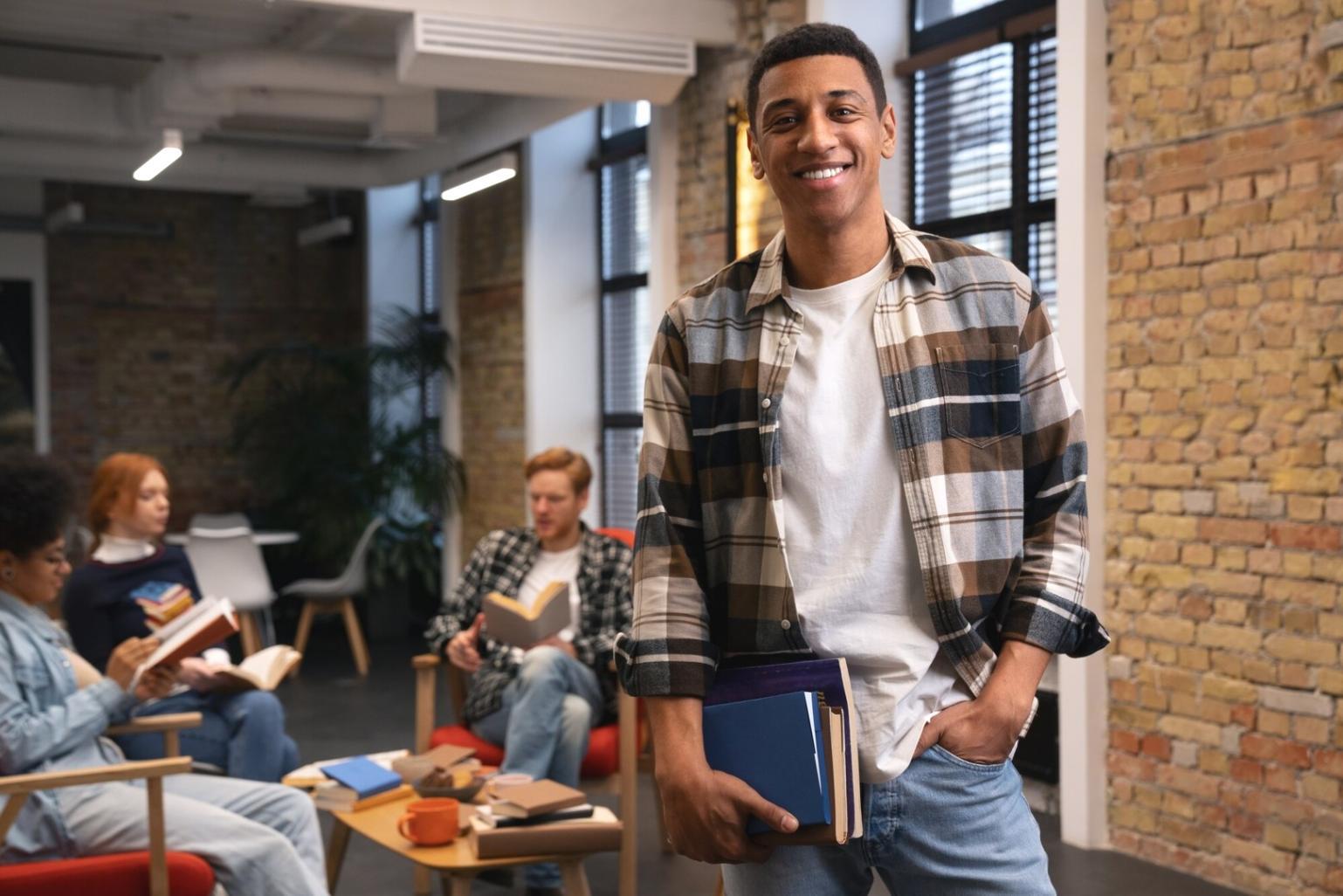 Business professional reviewing financial documents on laptop in modern workspace